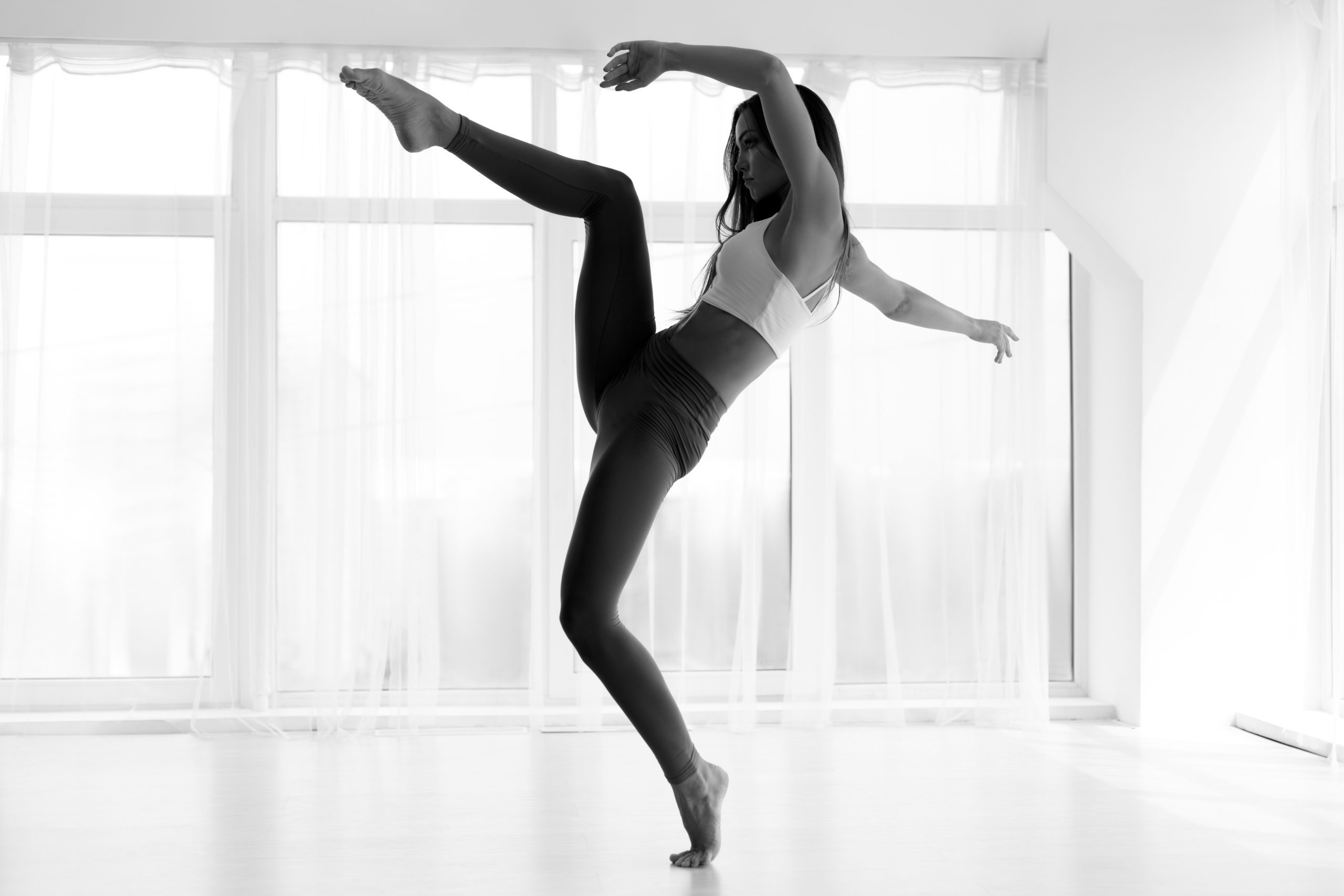 Modern Dance Artist Training In Ballet Class. Black And White, Copy Space
